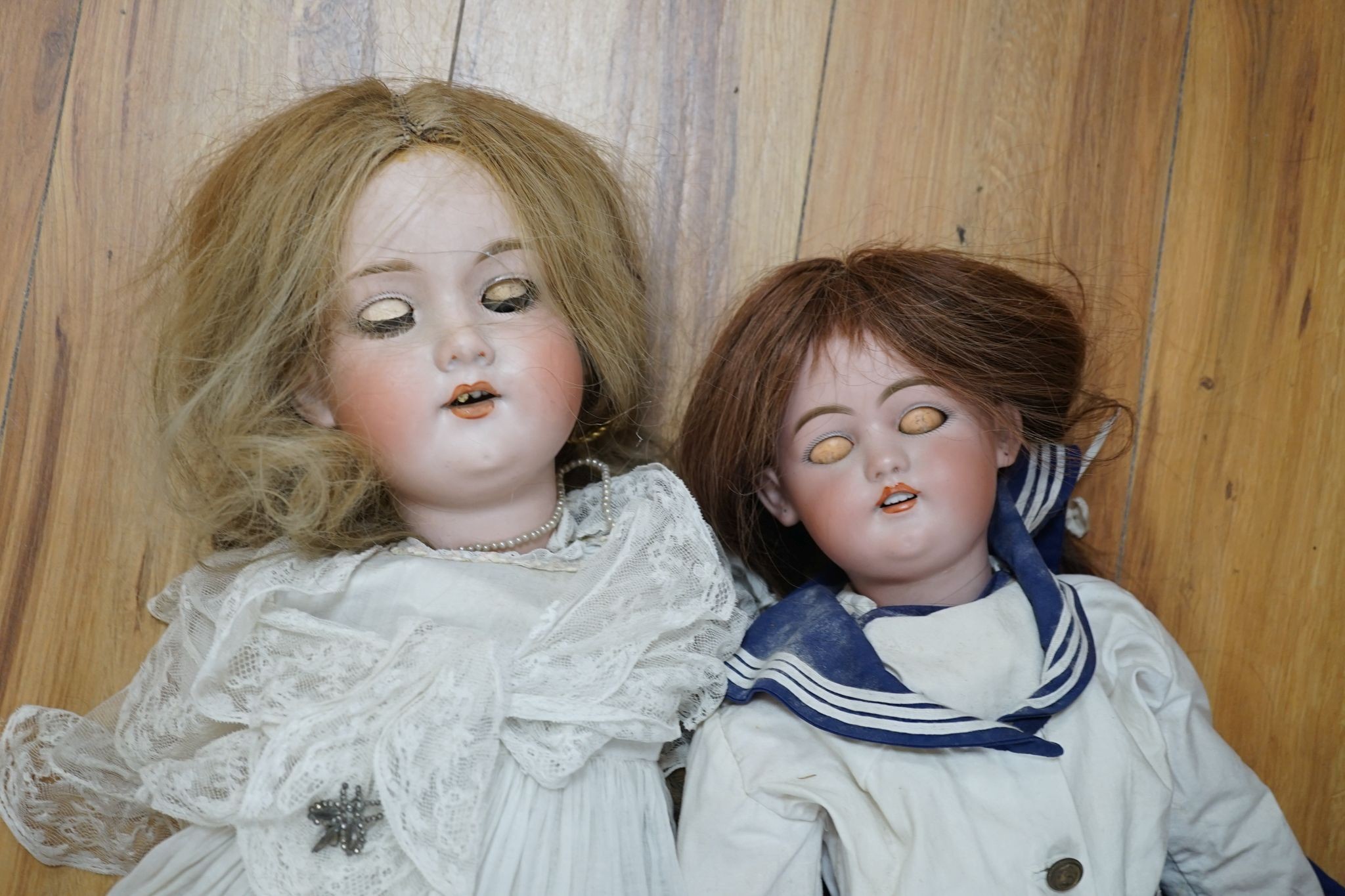 Two German bisque headed dolls, one Armand Marseille